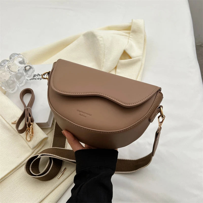 Chic Saddle Crossbody Bag for Women with Curved Flap and Adjustable Strap