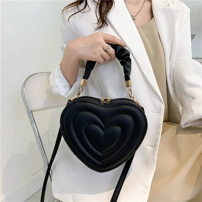 Heart-Shaped PU Leather Handbag with Padded Handle and Adjustable Shoulder Strap