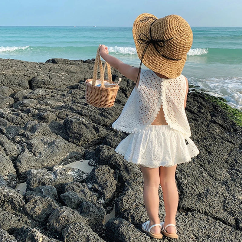 Charming Toddler Beach Outfit Set with Lace Detailing and Wide-Brim Straw Hat for Sun Protection.