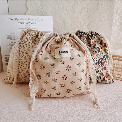 Elegant Drawstring Fabric Bags with Delicate Floral Patterns for Multi-purpose Use