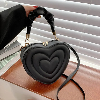 Heart-Shaped PU Leather Handbag with Padded Handle and Adjustable Shoulder Strap