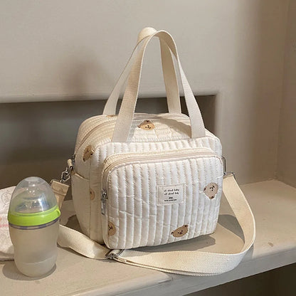 Versatile Quilted Diaper Bag with Embroidered Animal Prints, Ideal for Stroller Attachment and On-the-Go Use