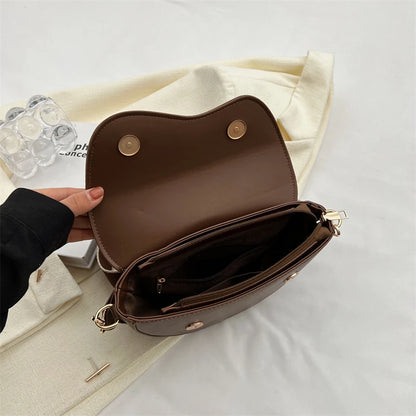 Chic Saddle Crossbody Bag for Women with Curved Flap and Adjustable Strap