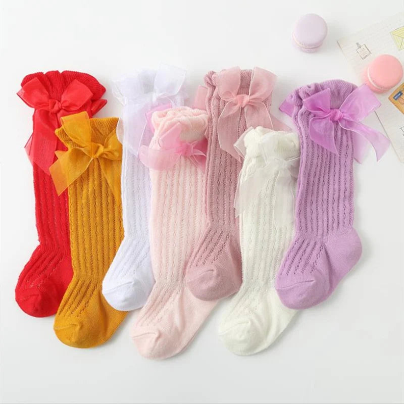 Knee-High Ribbed Socks for Girls with Delicate Bows and Soft Fabric