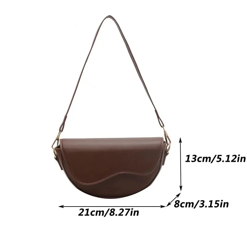 Sleek Saddle Crossbody Bag with Curved Flap and Wide Adjustable Strap