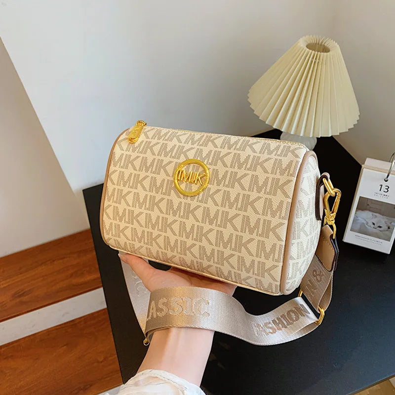 Luxury Monogram Shoulder Bag with Gold Accents and Adjustable Strap