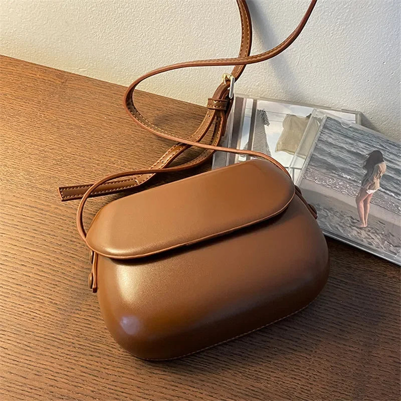 Compact Smooth Leather Crossbody Bag with Sleek Flap Design and Adjustable Strap