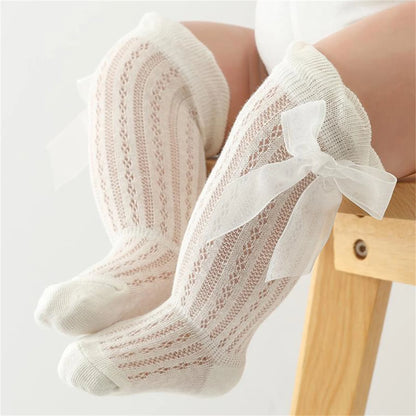 Knee-High Ribbed Socks for Girls with Delicate Bows and Soft Fabric