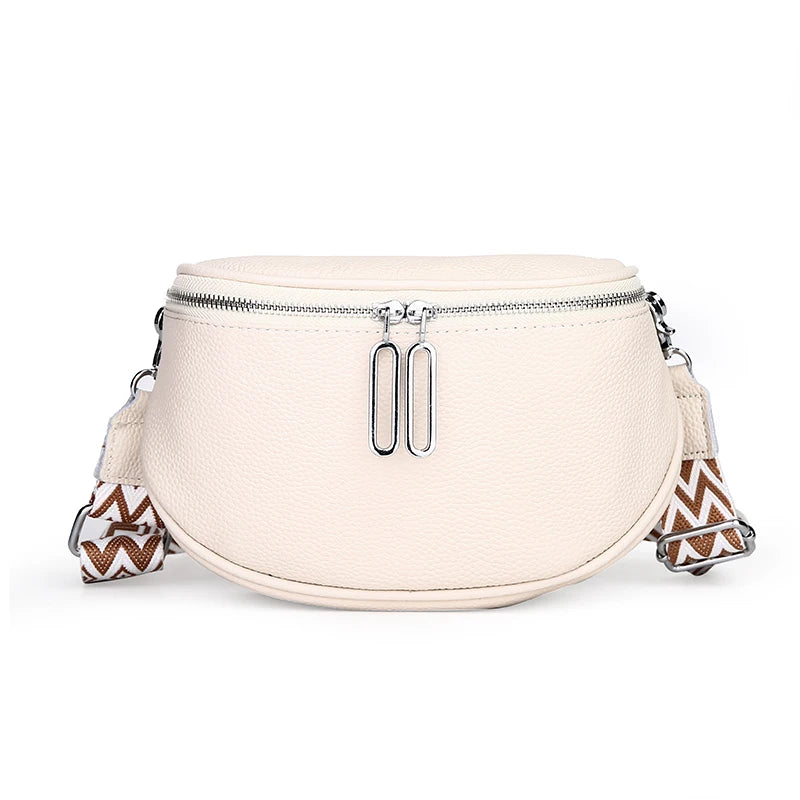 Sleek Leather Saddle Bag with Dual Zippers and Geometric Pattern Strap