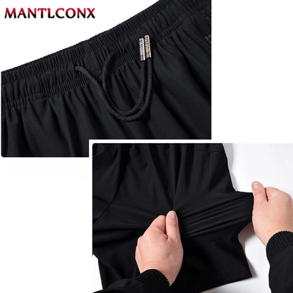 Men's Quick-Dry Athletic Shorts with Zipper Pockets and Reflective Accents, Featuring an Elastic Waistband and Drawstring Closure for Enhanced Comfort and Mobility