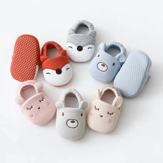 Adorable baby animal-themed indoor slippers with anti-slip soles, cushioned comfort, and easy slip-on design, perfect for keeping tiny feet warm and cozy