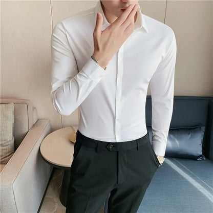 Men's slim fit dress shirt with long sleeves, stretchable fabric, and button-down front for a comfortable yet tailored business look