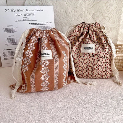 Elegant Drawstring Fabric Bags with Delicate Floral Patterns for Multi-purpose Use