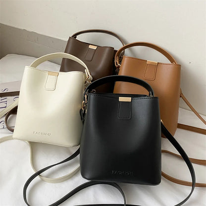 Elegant Faux Leather Bucket Shoulder and Crossbody Bag with Minimalist Design and Metal Accent, Perfect for Versatile Everyday Use