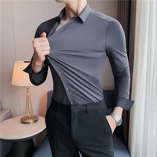 Men's slim fit dress shirt with long sleeves, stretchable fabric, and button-down front for a comfortable yet tailored business look