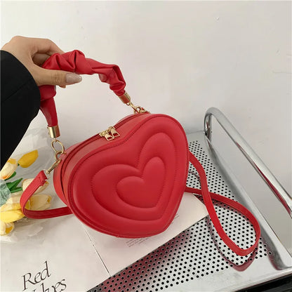 Heart-Shaped PU Leather Handbag with Padded Handle and Adjustable Shoulder Strap